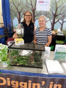 Gerri Harris and Renee Hedrick with butterflies in stages