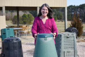 Rhonda Sherman with composting barrels