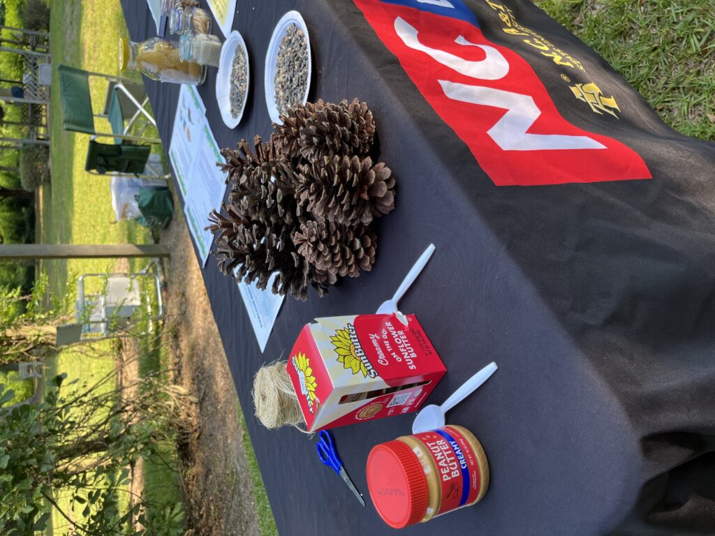 A table set up to create homemade bird feeders.